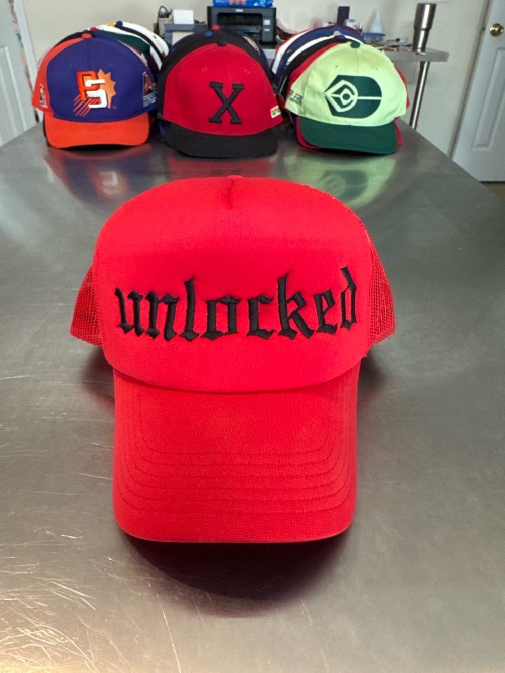 Red "unlocked" Mesh Trucker Cap